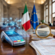 Bandiera dell'Unione Europea e documenti fiscali, che rappresentano il giudizio di Bruxelles sul fisco italiano